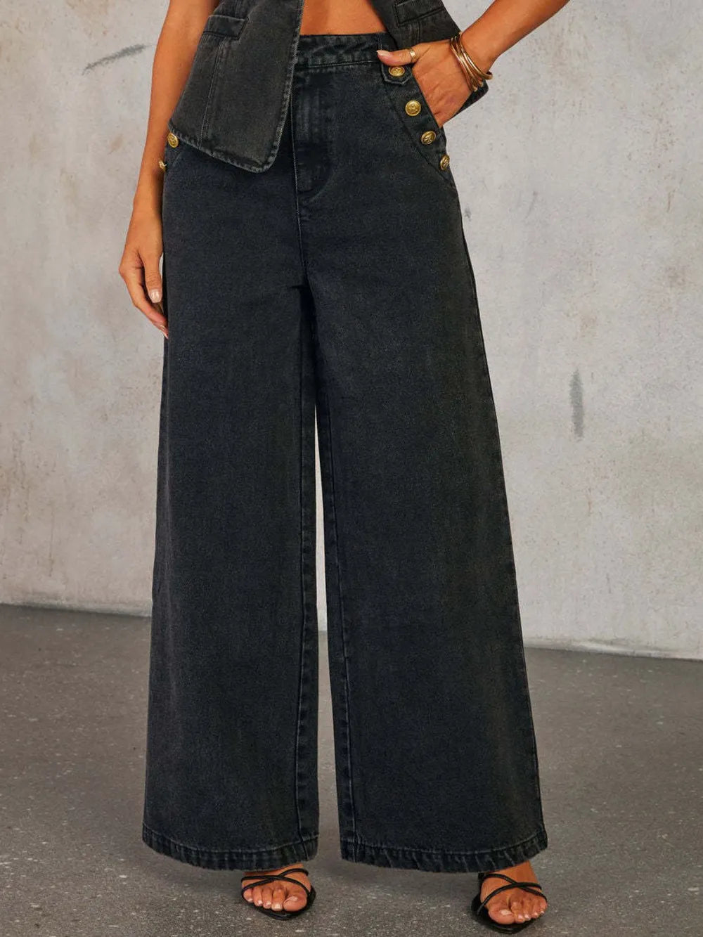 Light wash Trendsi high-rise wide leg jeans with button decor and classic five-pocket design, styled for a casual look.