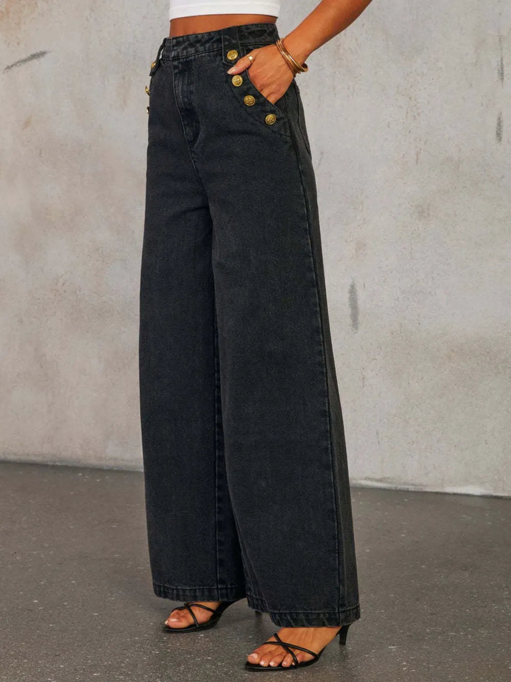 Light wash button-decor high-rise wide-leg jeans by Trendsi featuring a relaxed fit and classic denim style.