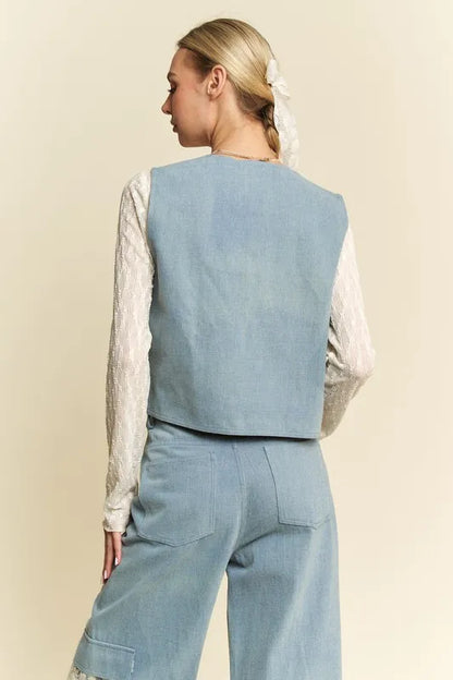 Light blue open front denim vest with lace patches and distressed details, by Davi & Dani for a stylish casual look.