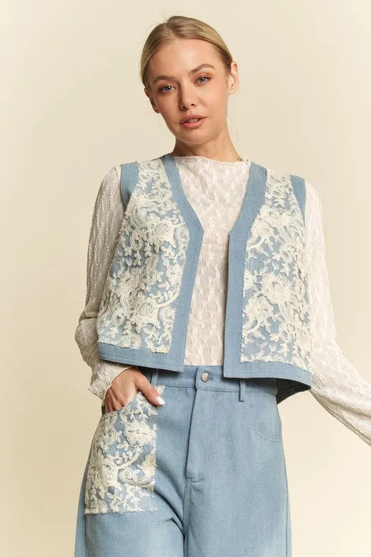 Light wash Davi & Dani lace patch open front denim vest with distressed details, casual sleeveless outerwear for a trendy look.