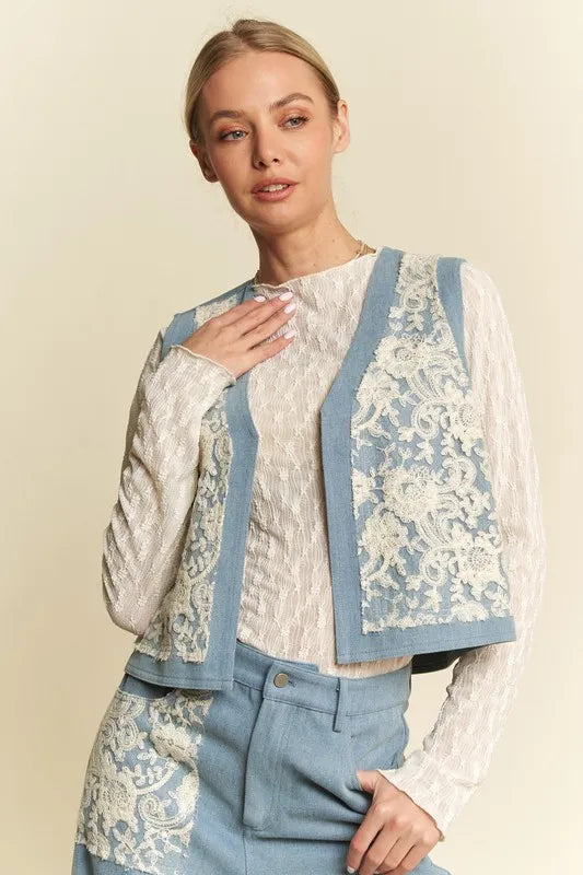 Light blue denim vest with lace patches and open front from Davi & Dani, featuring trendy distressed details and stylish design.
