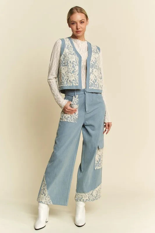 Light blue denim vest with lace patches and open front from Davi & Dani, styled with casual layering.