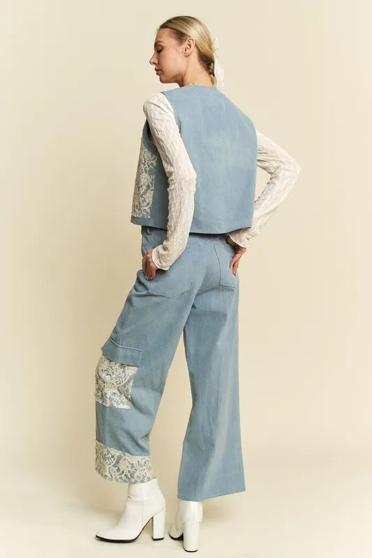 Light wash denim vest with lace patches, open front design, from Davi & Dani, styled with casual wear.