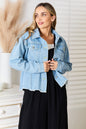 Light wash denim jacket by Trendsi featuring dropped shoulders and raw hem, casual style perfect for layered looks.