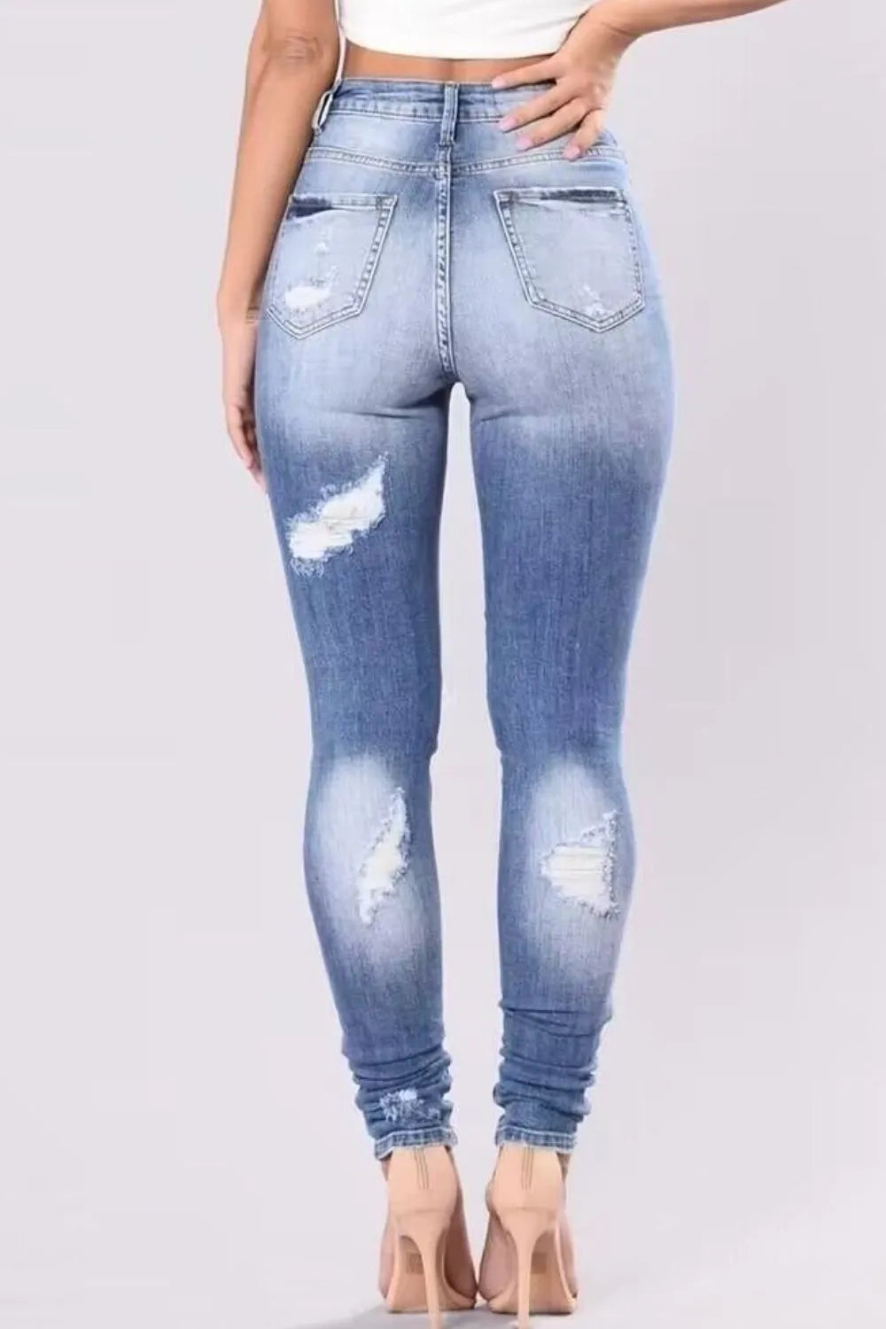 Light wash distressed plus size skinny jeans from Trendsi, full length with ripped detailing and a fitted silhouette