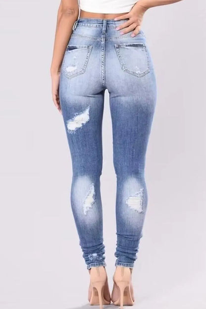 Light wash distressed plus size skinny jeans from Trendsi, full length with ripped detailing and a fitted silhouette