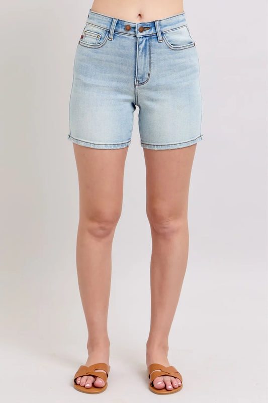 Light blue Judy Blue denim shorts with 2 buttons, pockets, and plus size fit, featuring a casual, relaxed style.