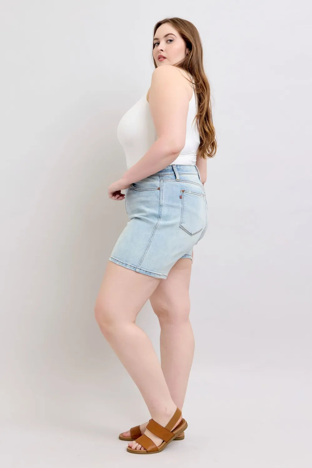 Light blue Judy Blue full-size denim shorts with 2 buttons and pockets, plus size, styled for casual summer wear.