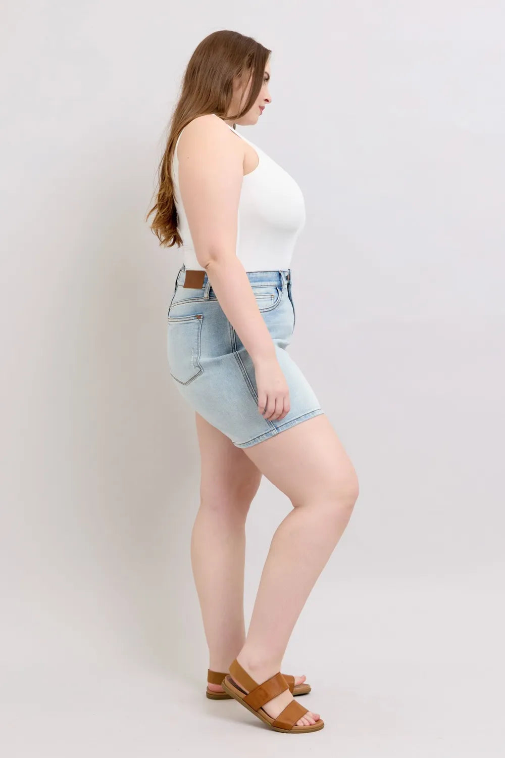 Light blue Judy Blue full-size denim shorts with two buttons and pockets, designed for plus size, by Trendsi.