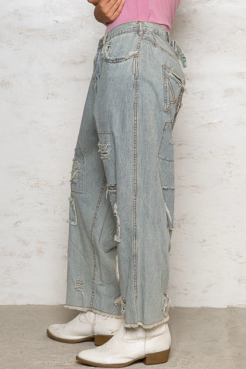 Light-colored POL distressed raw hem wide-leg pants from Trendsi, featuring a relaxed fit and trendy distressed detailing.