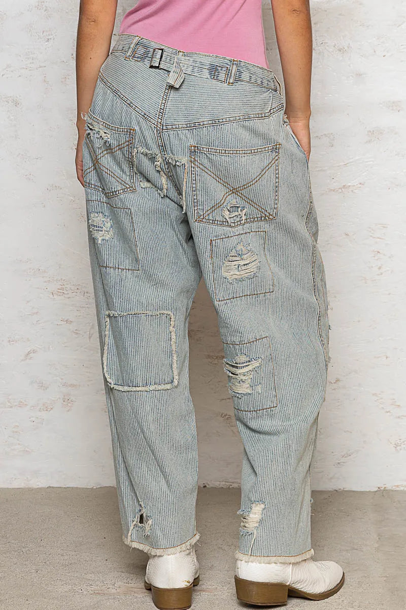 Light-colored POL distressed raw hem wide-leg pants by Trendsi, featuring a relaxed fit and stylish distressed details.