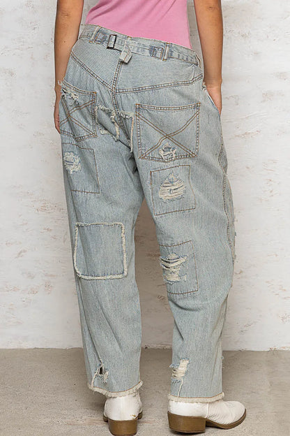 Light-colored POL distressed raw hem wide-leg pants by Trendsi, featuring a relaxed fit and stylish distressed details.