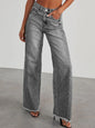 Light wash raw hem wide-leg jeans with pockets from Trendsi, featuring a relaxed fit and stylish design.