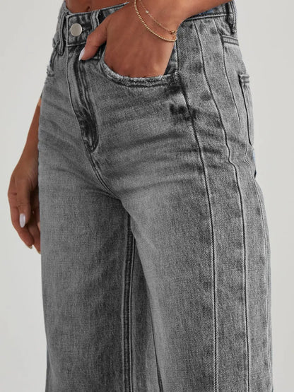 Light wash raw hem wide-leg jeans from Trendsi with side pockets, relaxed fit, and casual style.