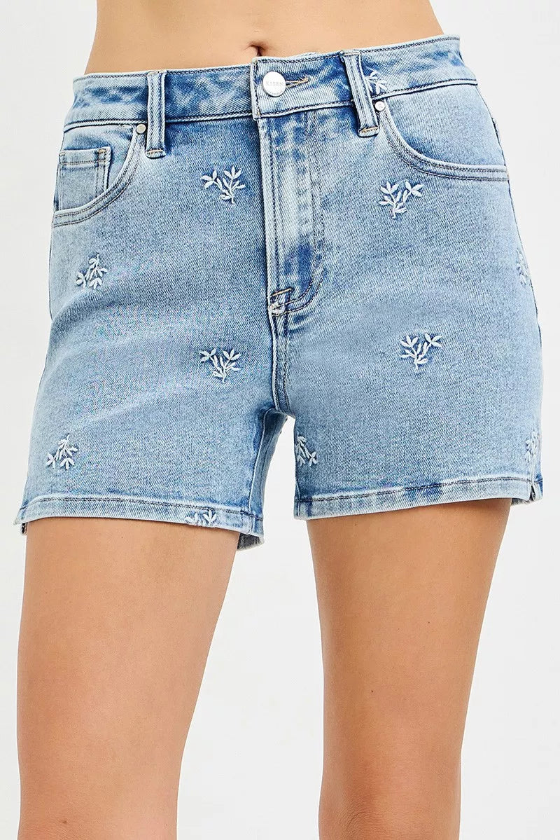 Light blue Risen high-rise denim shorts by Trendsi with embroidered detail and classic five-pocket design.
