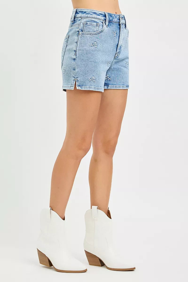 Light blue Risen high-rise denim shorts by Trendsi with embroidered detail and classic five-pocket design.