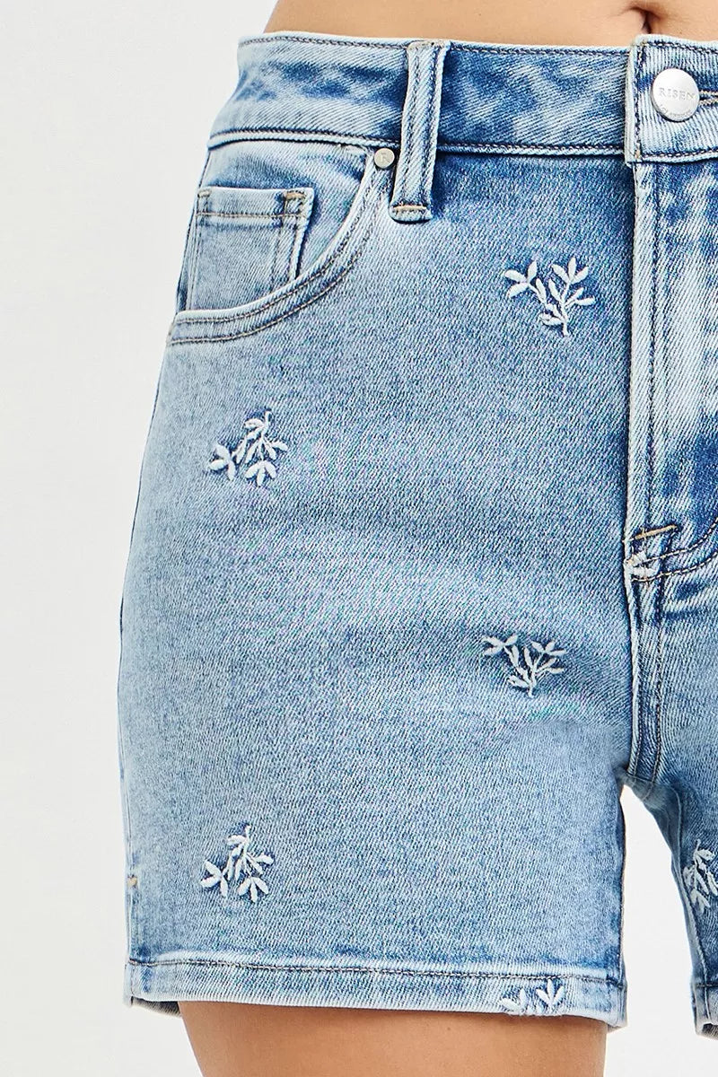 Light wash Risen high-rise denim shorts by Trendsi with embroidered detail, featuring a stylish fit and casual summer look.