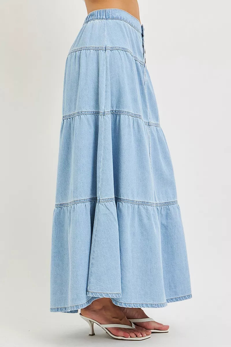 Light-colored RISEN high-rise ruffle long skirt from Trendsi, featuring flowy fabric and a stylish ruffled hem.