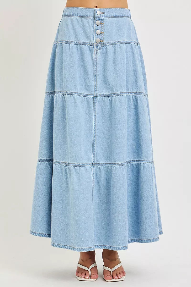 Light-colored Risen high-rise ruffle long skirt by Trendsi, featuring flowing fabric and layered ruffle design.