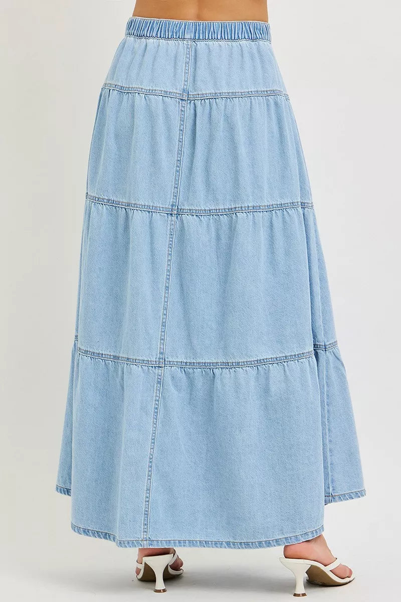 Light-colored high-rise Risen ruffle long skirt by Trendsi, featuring flowing fabric and stylish ruffle details.