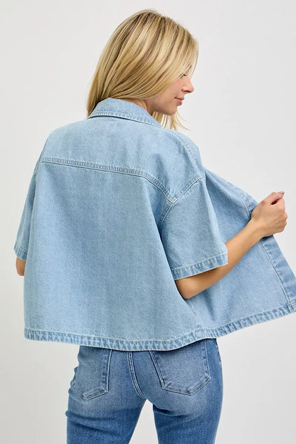 Light blue RISEN oversized half-sleeve cropped shirt by Trendsi, featuring a relaxed fit and casual style, shown on a mannequin.