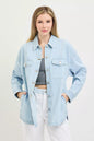 Light blue oversized stripe denim shacket by RISEN featuring a relaxed fit and button-front design.