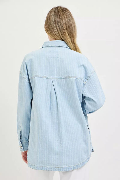 Light blue oversized stripe denim shaket by RISEN from Trendsi, featuring a relaxed fit and classic striped pattern.