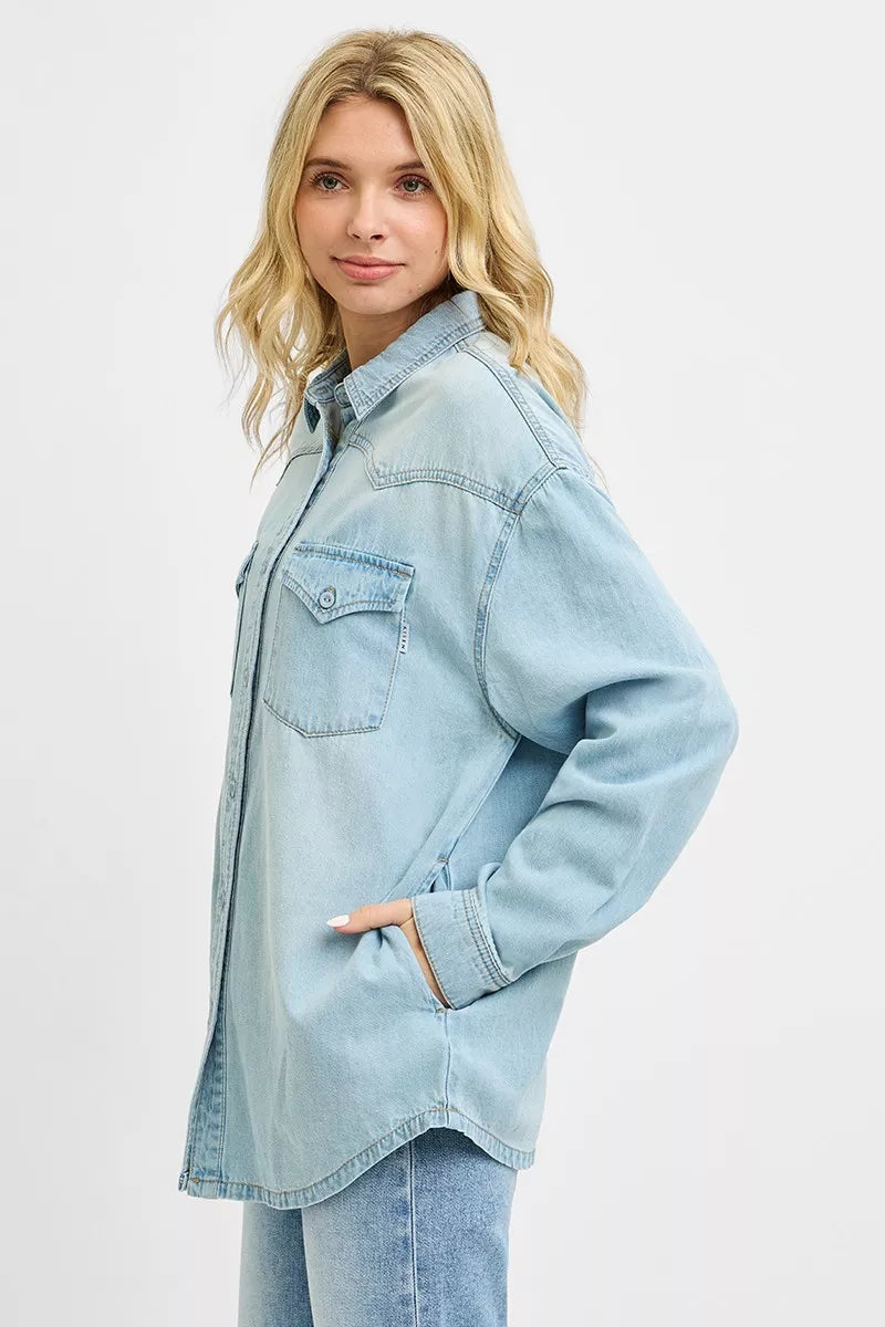 Light wash Risen Western yoke style relaxed fit denim shirt from Trendsi, featuring classic Western design and casual fit.