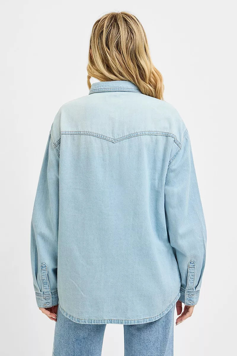 Light blue Risen Western Yoke Style relaxed fit denim shirt with button-up front and long sleeves, casual western-inspired design.