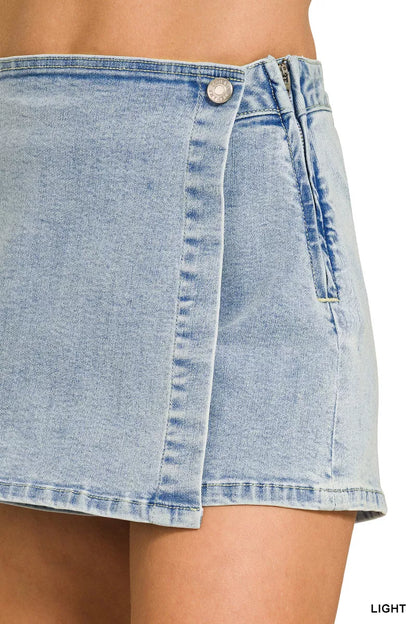 Light denim Zenana wrap-front skort by Trendsi, featuring a stylish front wrap design and classic denim fabric.