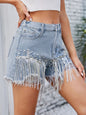 Light wash distressed pearl trim denim shorts with pockets, styled by Trendsi. Perfect casual summer shorts for a relaxed look.