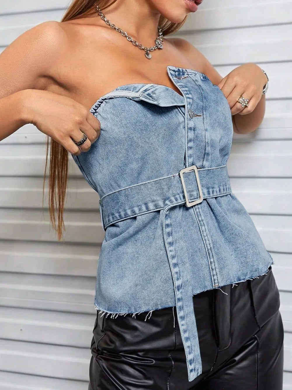 Light blue frayed hem button detail tube top by Trendsi, close-up of the casual sleeveless crop top with distressed hem.