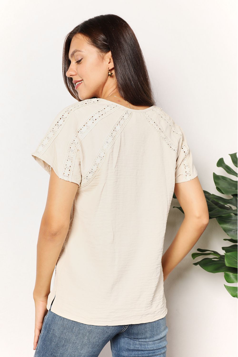 Light yellow crochet short sleeve top with button details from Trendsi, featuring a stylish, casual design.