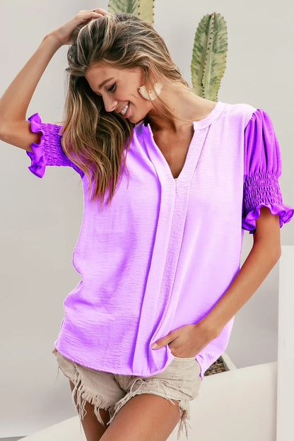 Lilac dusty lavender BiBi Air Flow color block puff sleeve V-neck top by Trendsi, showing the stylish design and fabric details.