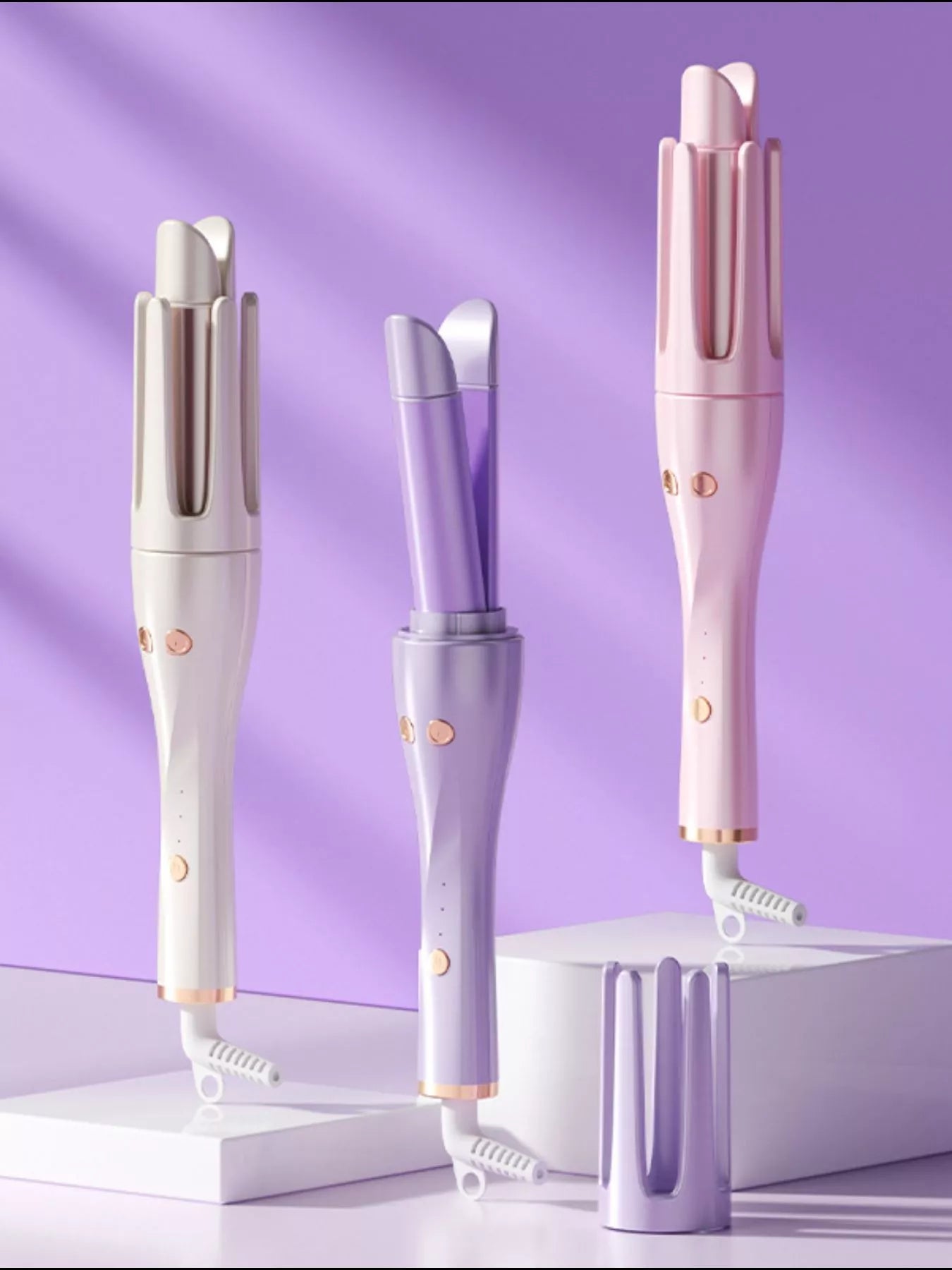 Trendsi automatic rotating hair curling iron with lilac finish and European plug, showcasing the curling barrel and handle.