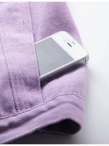 Plus size sleeveless denim jacket by Trendsi with full button-down front and raw hem, displayed in lilac color.