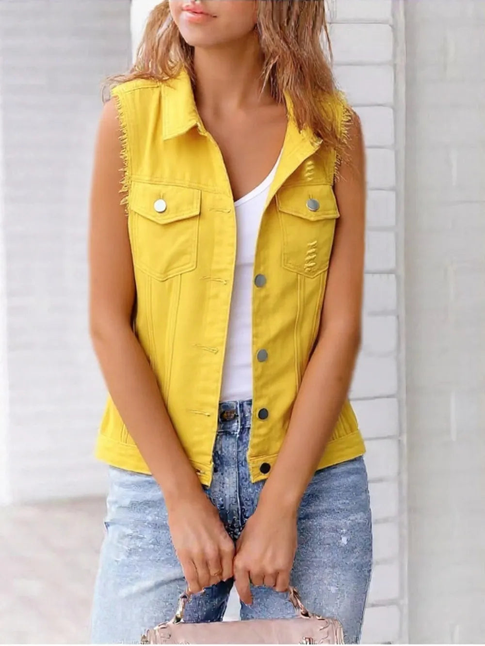Plus size lilac sleeveless denim jacket with full button-down front and raw hem from Trendsi, showcasing a casual, trendy style.