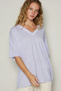 Light purple Trendsi POL V-Neck Half Sleeve T-Shirt displayed on a model, showcasing its relaxed fit and soft fabric.