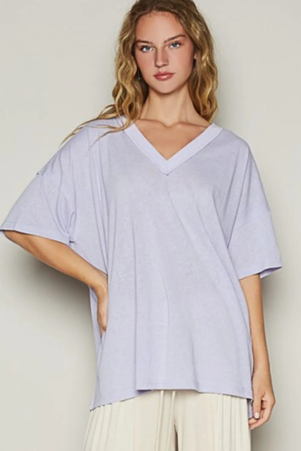 Lilac POL V-Neck Half Sleeve T-Shirt from Trendsi showing the fitted casual top with short sleeves and V-neck design.