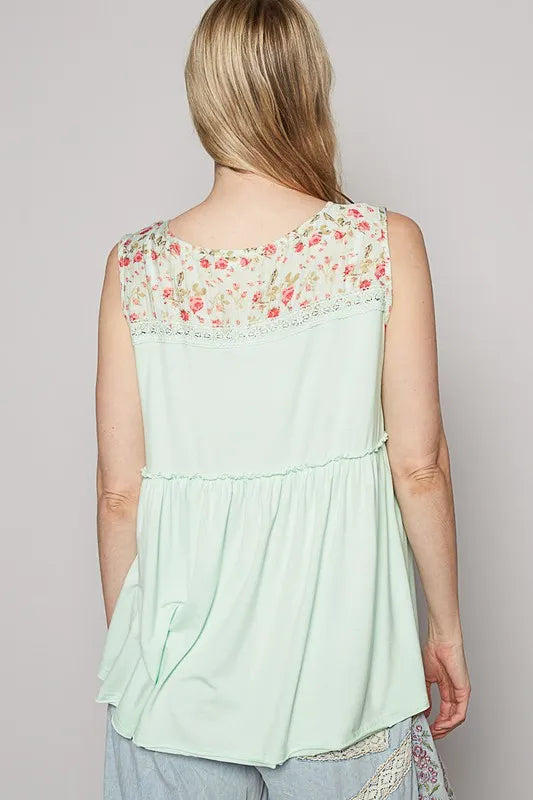 Lime cream sleeveless floral top with lace detail, frill accents, and V-neck from Trendsi, showcasing feminine summer fashion.