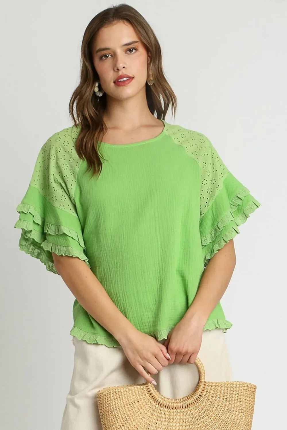 Plus size Umgee cotton gauze blouse with ruffle eyelet layered sleeves and a round neck, in a lime color.