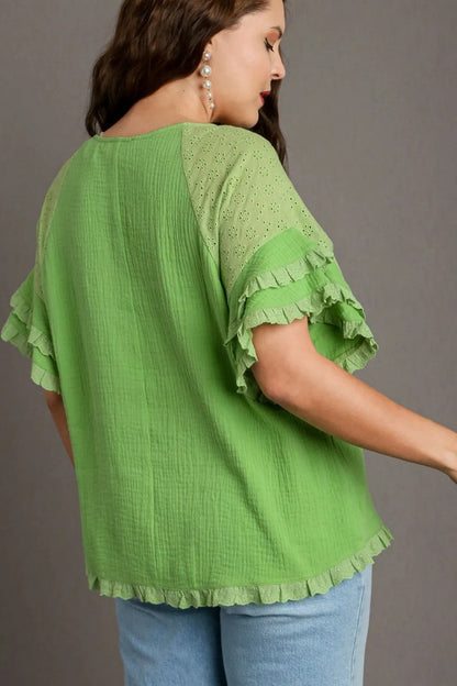 Plus size Umgee cotton gauze blouse with ruffle eyelet layered sleeves and round neck, styled in a lime green color.