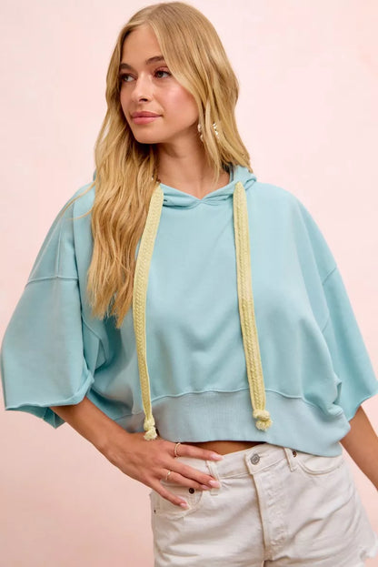 Light blue BiBi washed terry short sleeve hoodie top with drawstring neckline, casual and comfortable fashion by Trendsi.