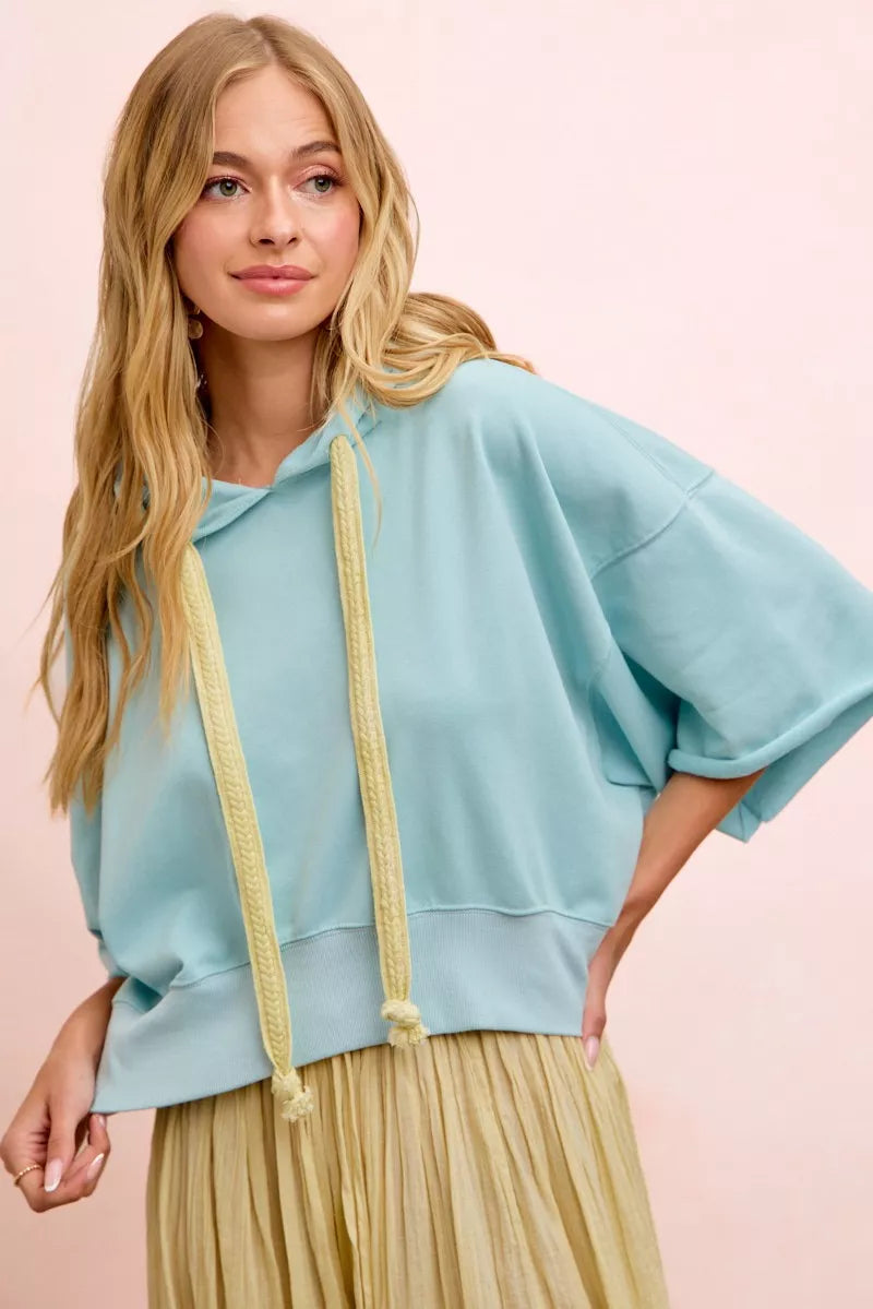 Light blue BiBi washed terry short sleeve hoodie top with drawstrings, casual and comfortable for everyday wear.