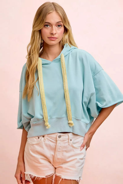 Light blue BiBi washed terry short sleeve drawstring hoodie top from Trendsi, casual and comfortable for everyday wear.
