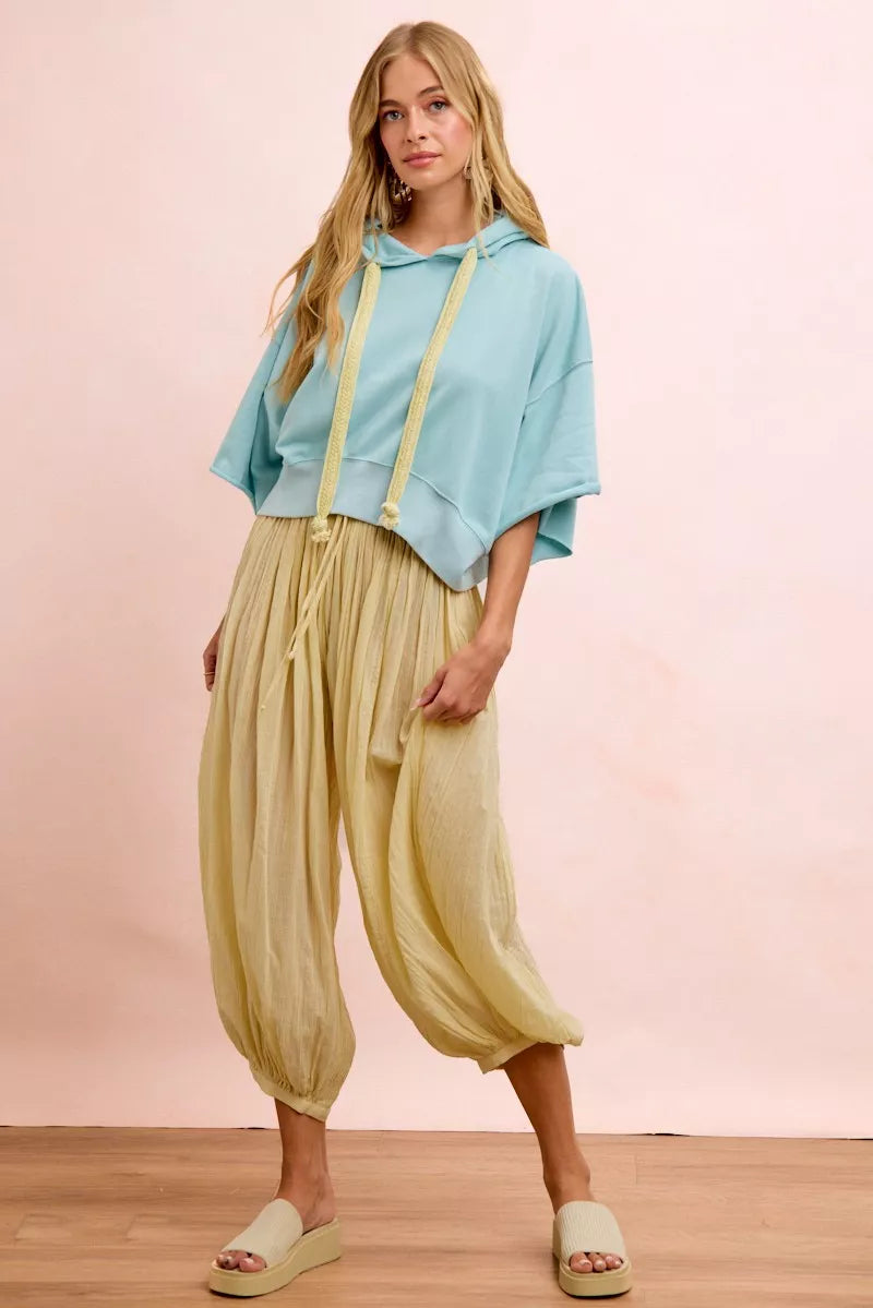 Light blue BiBi washed terry short sleeve hoodie top with drawstring detail, casual and comfortable, perfect for relaxed wear.