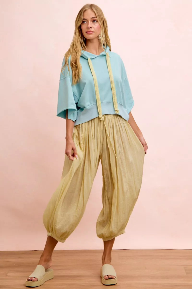 Trendi pale lemon blue BiBi washed terry short sleeve hoodie top with drawstring neckline and relaxed fit.