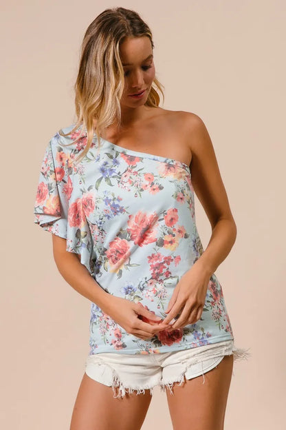 Light blue BiBi floral print jersey knit ruffle sleeve top by Trendsi, featuring a relaxed fit and feminine ruffle details.
