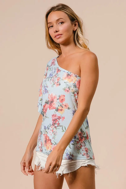 Trendi blue floral printed jersey knit ruffle sleeve top with short sleeves and a relaxed fit, perfect for casual wear.