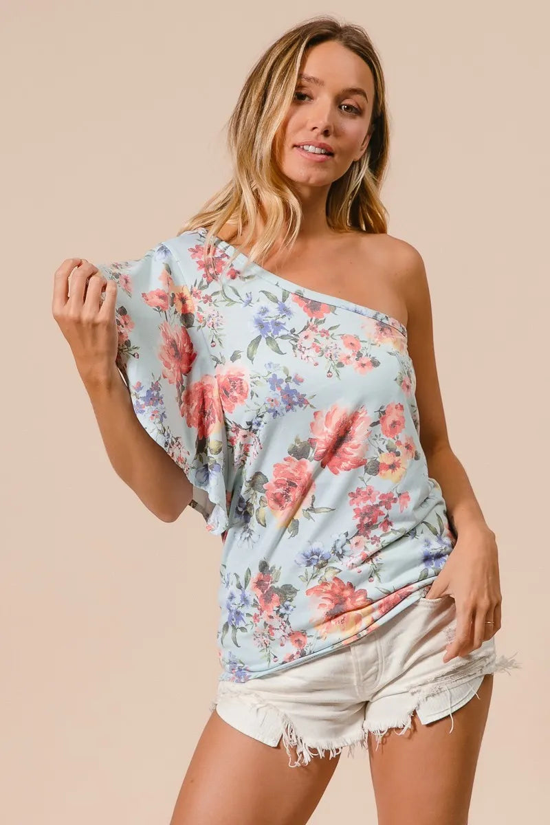 Blue floral printed jersey knit ruffle sleeve top by Trendsi, featuring a comfortable fit and stylish ruffle details.